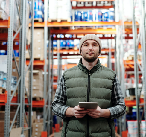Man in warehouse checking inventory